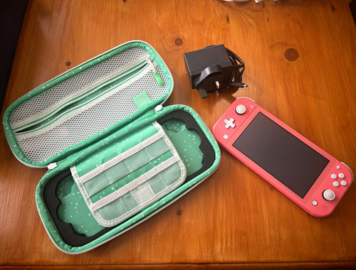 Nintendo switch lite coral - nintendo,