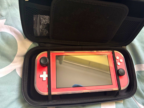 Nintendo switch lite coral - nintendo,